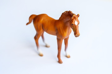 Figurine of a horse on white background