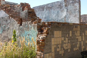 Ruined house. Remains of old houses. Apocalypse. Abandoned city. City of ghosts. Ruins of old...