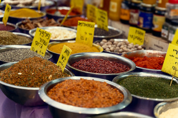 closeup of a table of different types of spices for sale