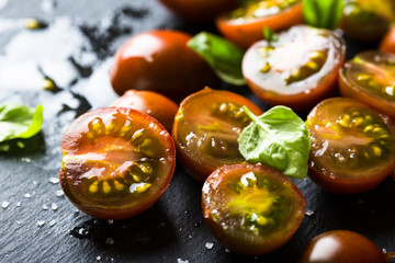 Appetizer of fresh cherry tomatoes, basil and olive oil