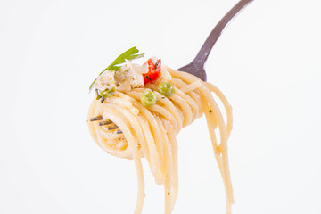 Spaghetti with cream sauce with smoked mackerel, peas ,bell pepper and some parsley eaten with a...