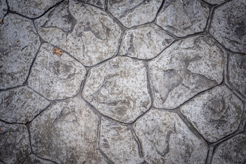 Old and dirty stone floor of footpath for stone background and texture.