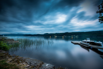 Moody sky over lake at night