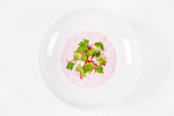 Cold borscht (chlodnik) - traditional Lithuanian cold soup with radish, parsley and dill