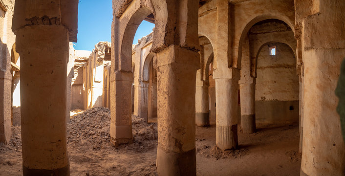 Desert town of Mhamid, Morocco village with nature sand dunes and old muslim mosque in north Africa, old narrow streets, traditional clay mud architecture