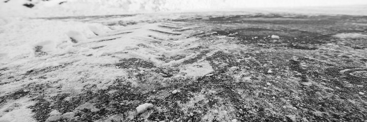Road with tire tracks in the snow