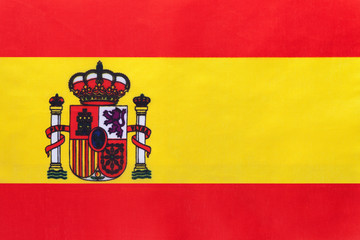 Spain national fabric flag, textile background. Symbol of international world european country.