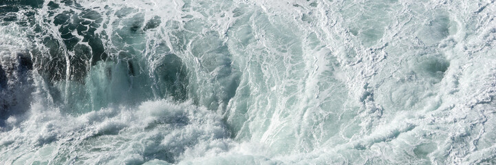 Fototapeta na wymiar Panoramic water surface texture. Sea water splash with foamy wave