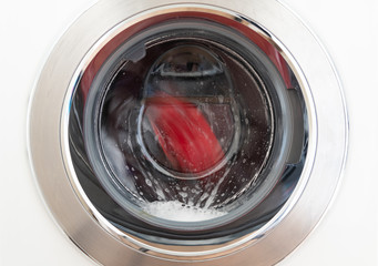 Modern washing machine cleaning clothes.