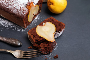 Delicious homemade chocolate cake with whole pears