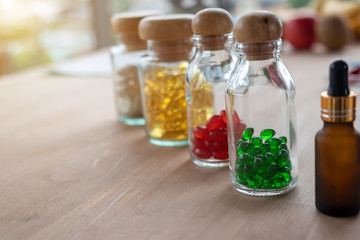 Close-up of medicine bottles on a wooden table