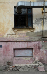 Old dilapidated house in the old district of Magnitogorsk, Soviet construction.