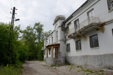 Old dilapidated house in the old district of Magnitogorsk, Soviet construction.
