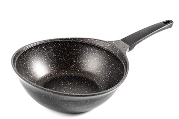 black fry pan over white background