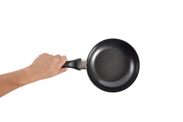 Hand holding a black frying pan. Isolated on white background
