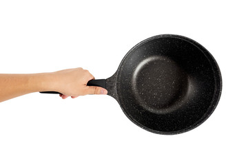 Hand holding a black frying pan. Isolated on white background