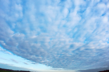 The sky with clouds. Blue sky and clouds. White clouds in the blue sky.