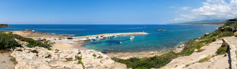 Fototapeta na wymiar Harbor on the Mediterranean Sea, view of the blue water of the sea, Agios Georgios Pegeias, Paphos? Cyprus