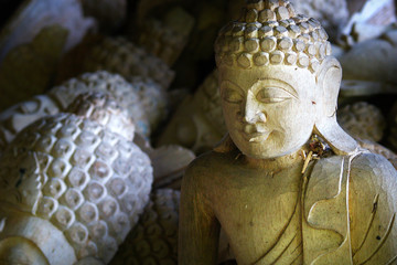 wooden carved statue of buddha in hindu temple in Bali-Indonesia