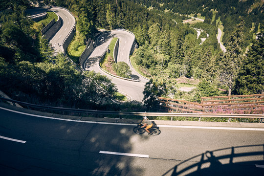 Cyclist on Maloja Pass Switzerland