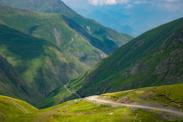 Mountain landscape, beautiful green mountain road blue sky, Abano pass, Tusheti, Georgia