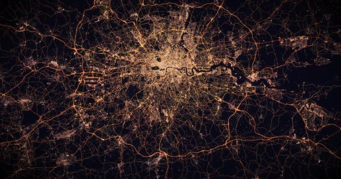 Aerial night view of city of London, UK. Traffic and street light glowing. Camera flying high above, moving slowly forward from space filming cinematic straight down. 3d animation rendering.