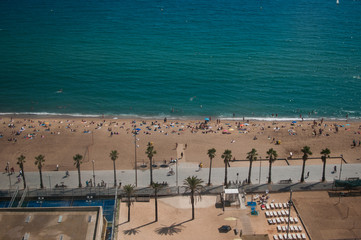 BARCELONA, SPAIN - SEPTEMBER 9, 2014: Aerial view of people on the Barceloneta beach, Mediterranean coastline in Barcelona
