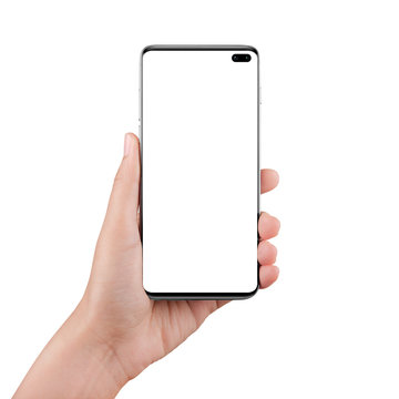 Isolated female hand holding a cellphone with clipping path