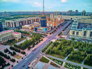 NUR-SULTAN, KAZAKHSTAN (QAZAQSTAN) - July 29, 2019: Beautiful panoramic aerial drone view to Nursultan (Astana) city center with skyscrapers and Baiterek Tower - symbol of Kazakh people freedom