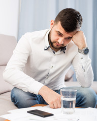 Man having prolem and spending day alone