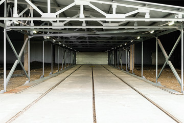 Long industrial passage with wide railroad gauge
