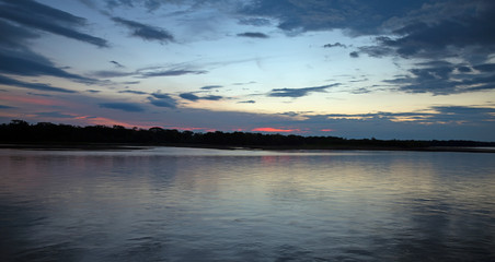 Fototapeta na wymiar Sunset on Napo river in the jungle of Ecuador
