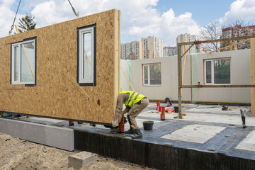 Fototapeta Construction of new and modern modular house obraz
