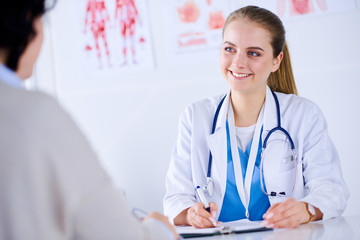 Doctor and patient are discussing something in medical office