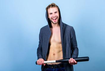 Strong and confident. Sport equipment. Sportsman strong macho looks threatening with bat....