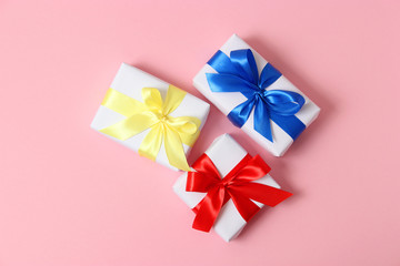 gifts on a colored background top view. Holiday, giving presents, birthday.