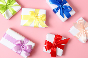 gifts on a colored background top view. Holiday, giving presents, birthday.