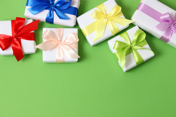 gifts on a colored background top view. Holiday, giving presents, birthday.