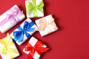 gifts on a colored background top view. Holiday, giving presents, birthday.