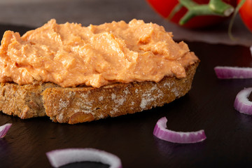Spread on a toast bread with chopped purple onion
