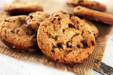 Chocolate cookies on wooden table. Chocolate chip cookies shot on wooden white table