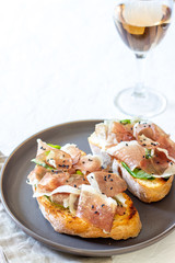 Bruschetta with prosciutto . Italian cuisine. National food.