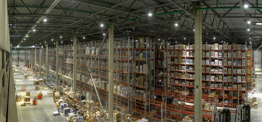 Warehouse interior with shelves, pallets , boxes and equipment