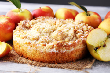 Apple pie or homemade cake with apples on wood. Delicous dessert apple tart