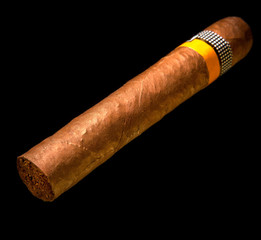 rolled cigar from a tobacco leaf on a black background, Small depth of sharpness..