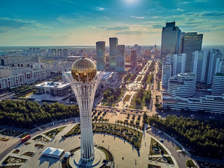 NUR-SULTAN, KAZAKHSTAN (QAZAQSTAN) - August 11, 2019: Beautiful panoramic aerial drone view to Nursultan (Astana) city center with skyscrapers and Baiterek Tower - symbol of Kazakh people freedom - obrazy, fototapety, plakaty