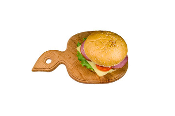 Fresh hamburger on a wooden cutting board isolated on white background