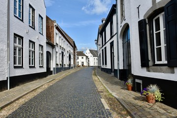 Fototapeta na wymiar Street in the picturesque white village of Thorn, Limburg, Holland