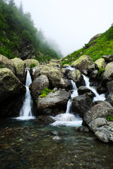 Fototapeta na wymiar Waterfall on a mountain river