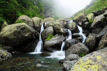 Naklejka na ściany i meble Waterfall on a mountain river